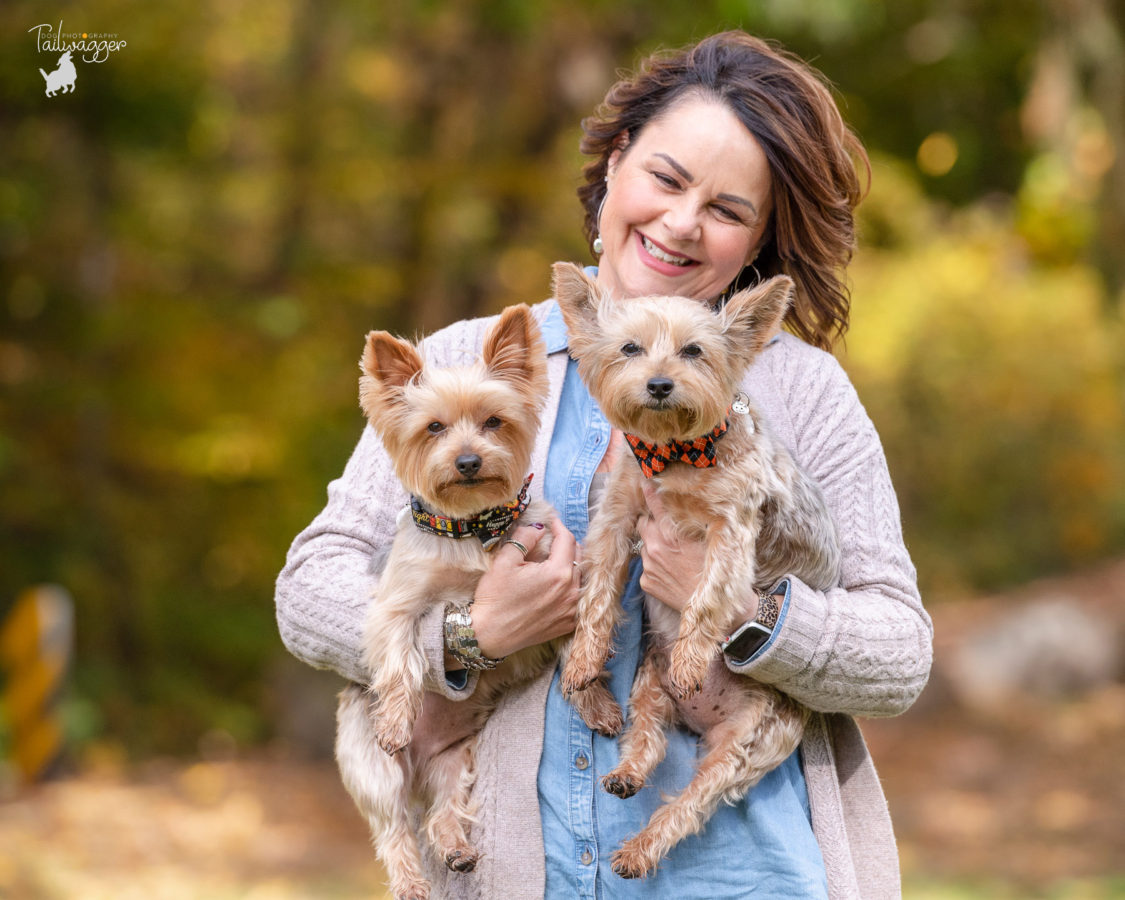 A woman and her two male Yorkshire terriers pose for a family portrait by Grand Rapids Pet photographer, Tailwagger Dog Photography.